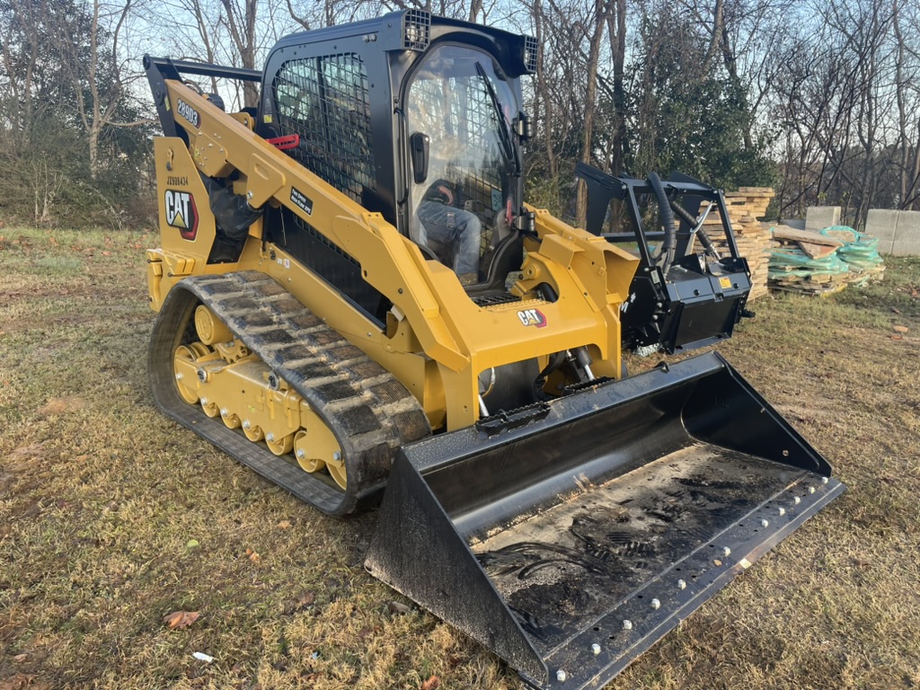 CAT compact track loader with grading bucket